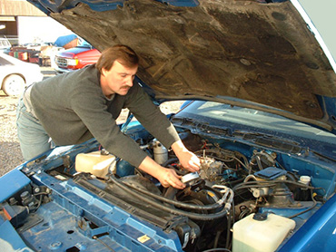 John Connors fixing an engine